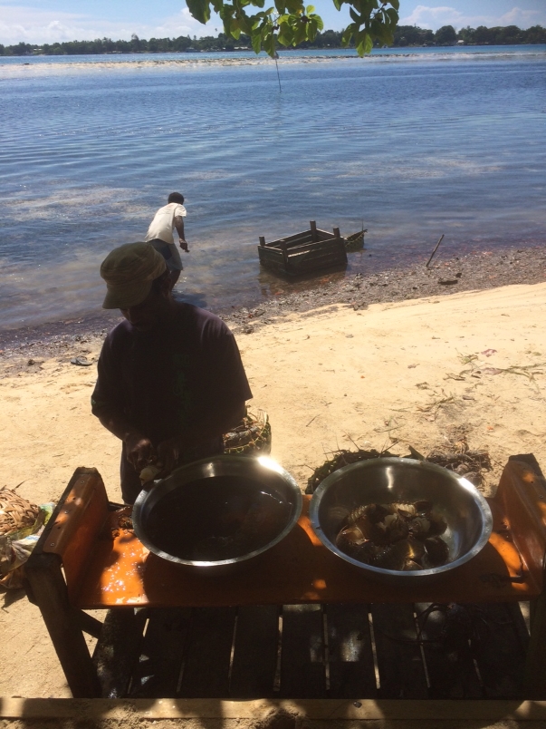 The kitchen staff preparing our lobster.