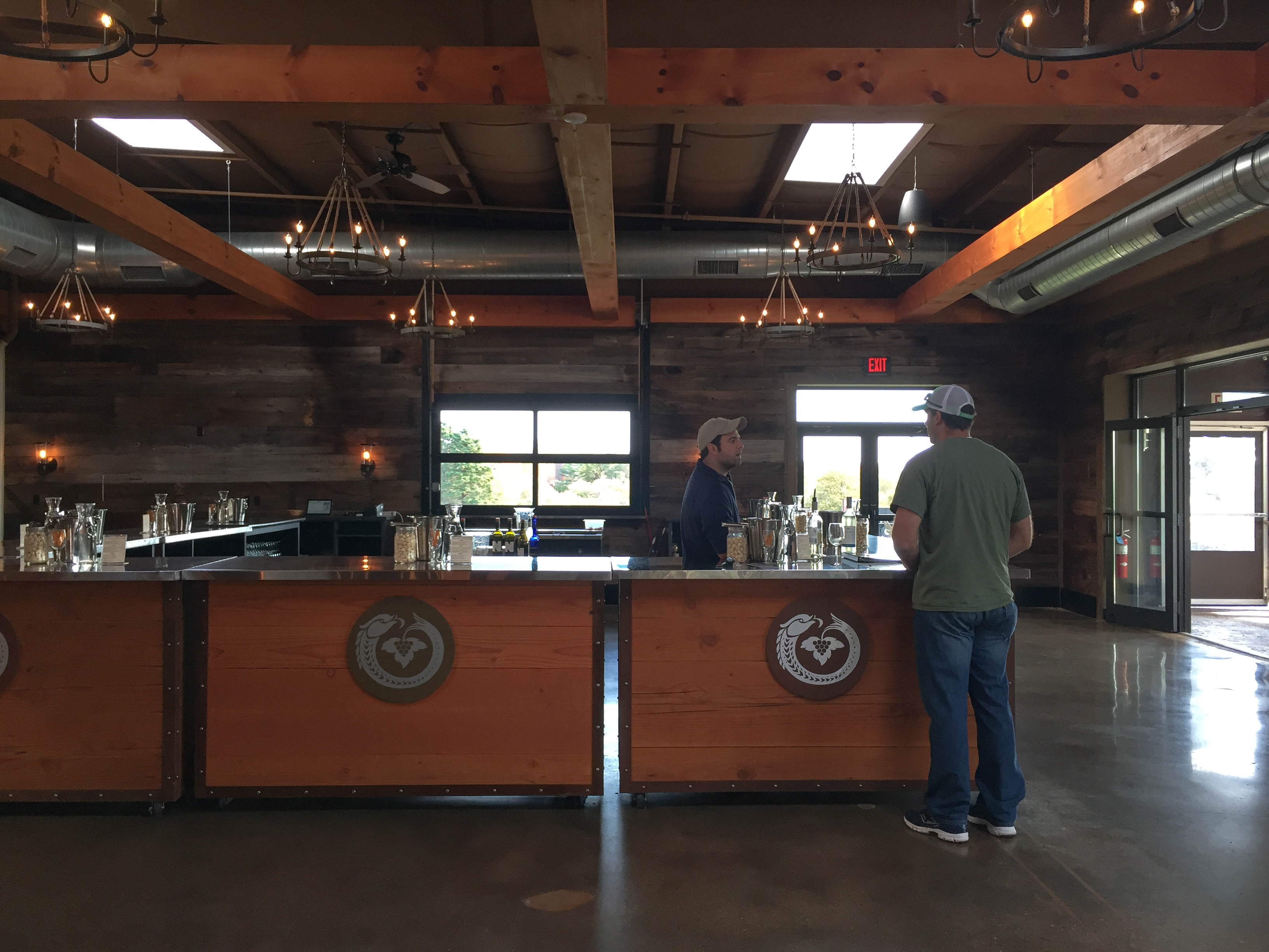 Brenden DePrest serving wine at Newport Vineyards The Coastal Wine Trail