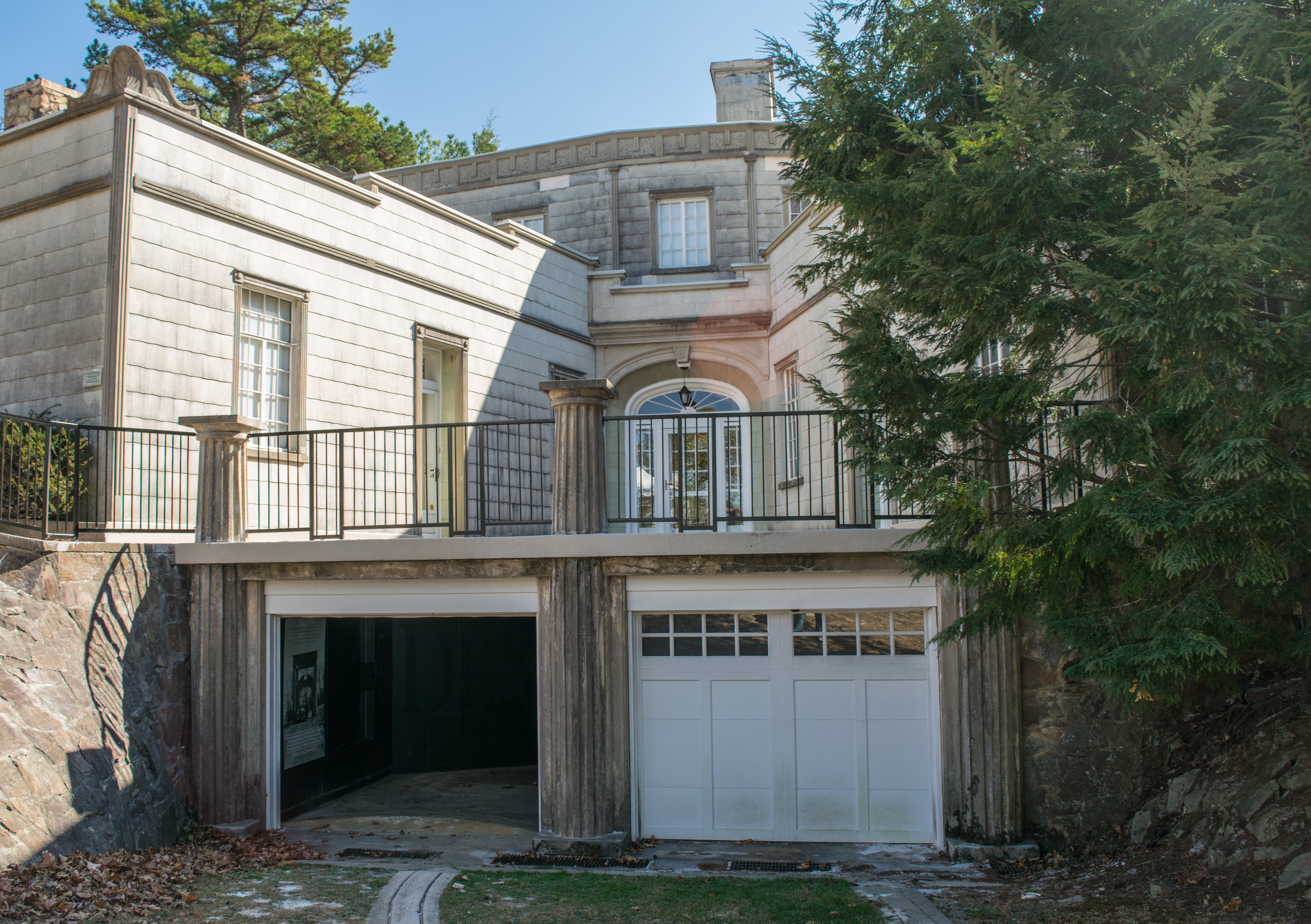 Entry to garage and a patio formed against the X-patterned wings - Burritt Mansion Museum Huntsville AL