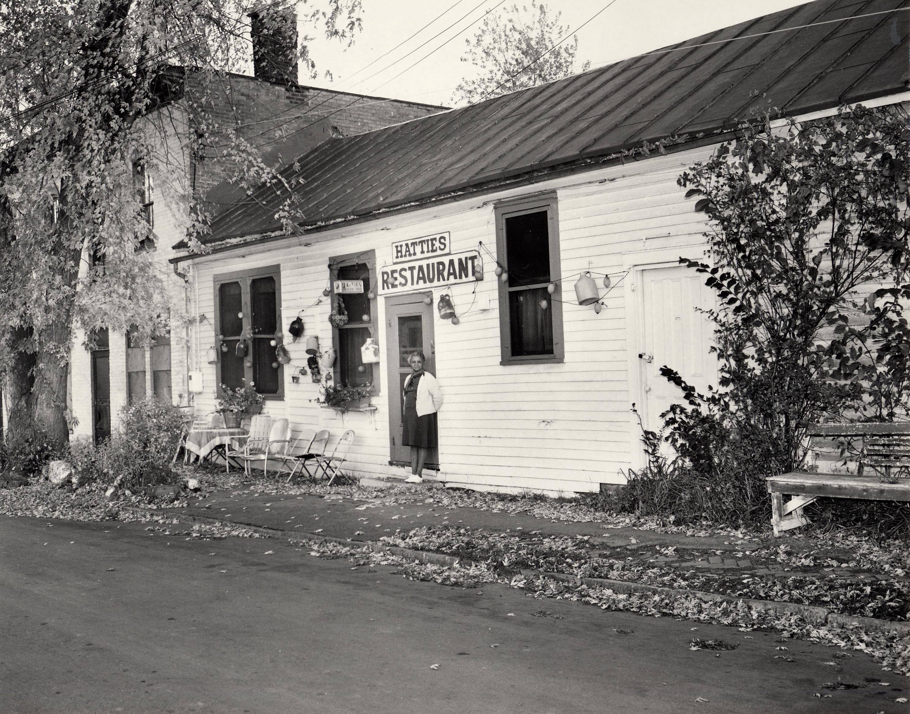 Historic photo of Hattie Boseley in front of her restaurant