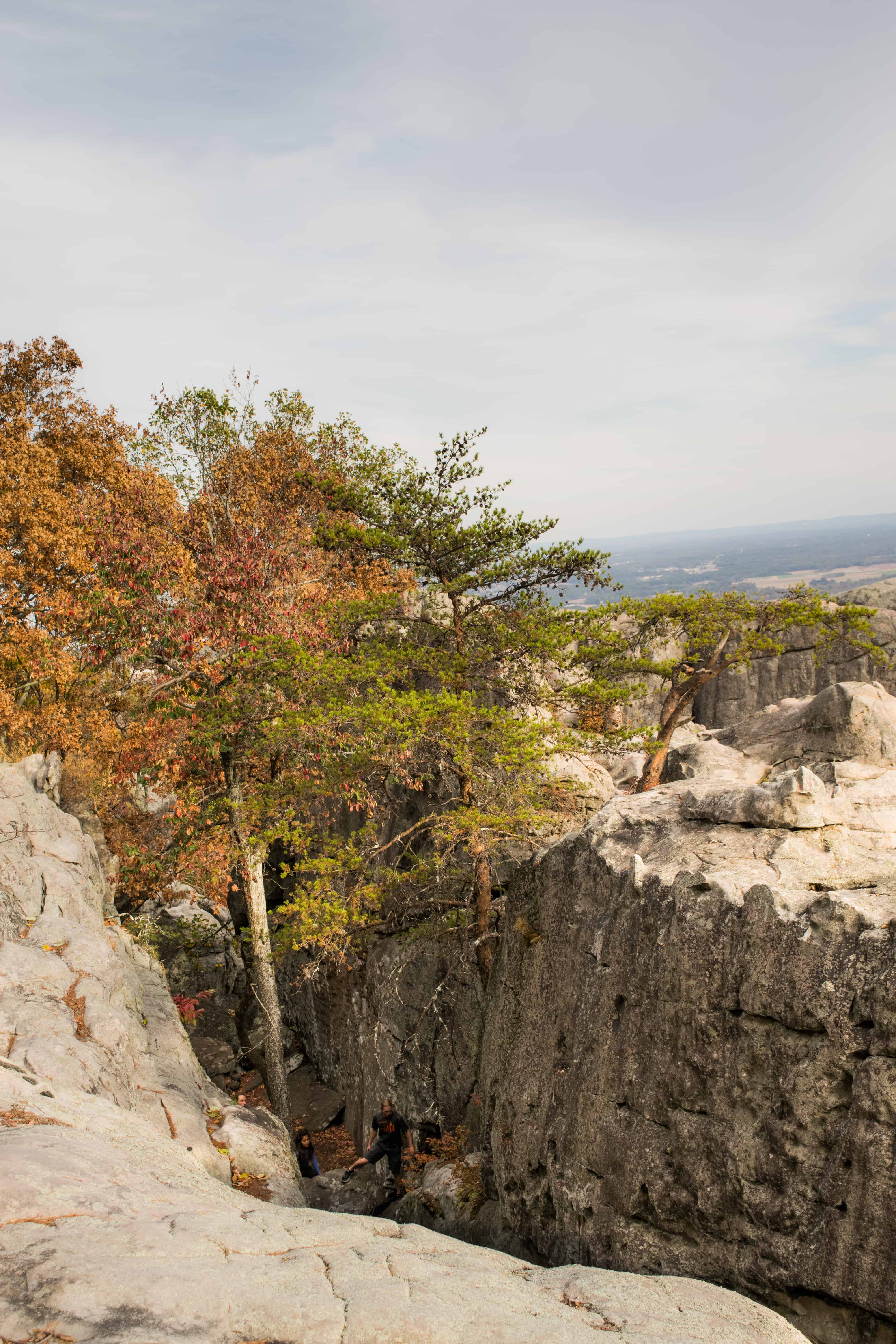 Walking through boulder crevices cherokee Rock Village