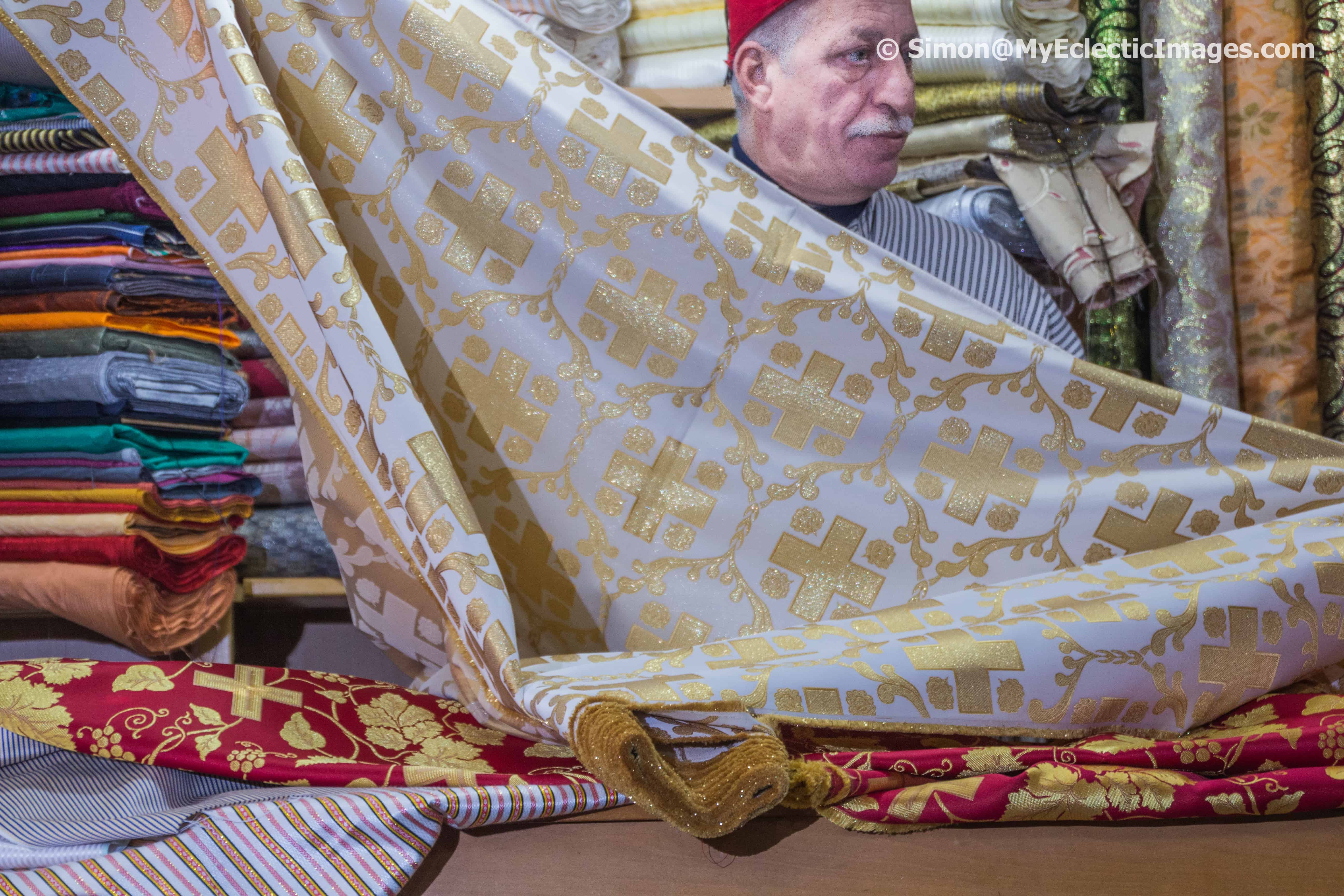 Exotic Cloth Merchant Displaying His Wares in Jerusalem