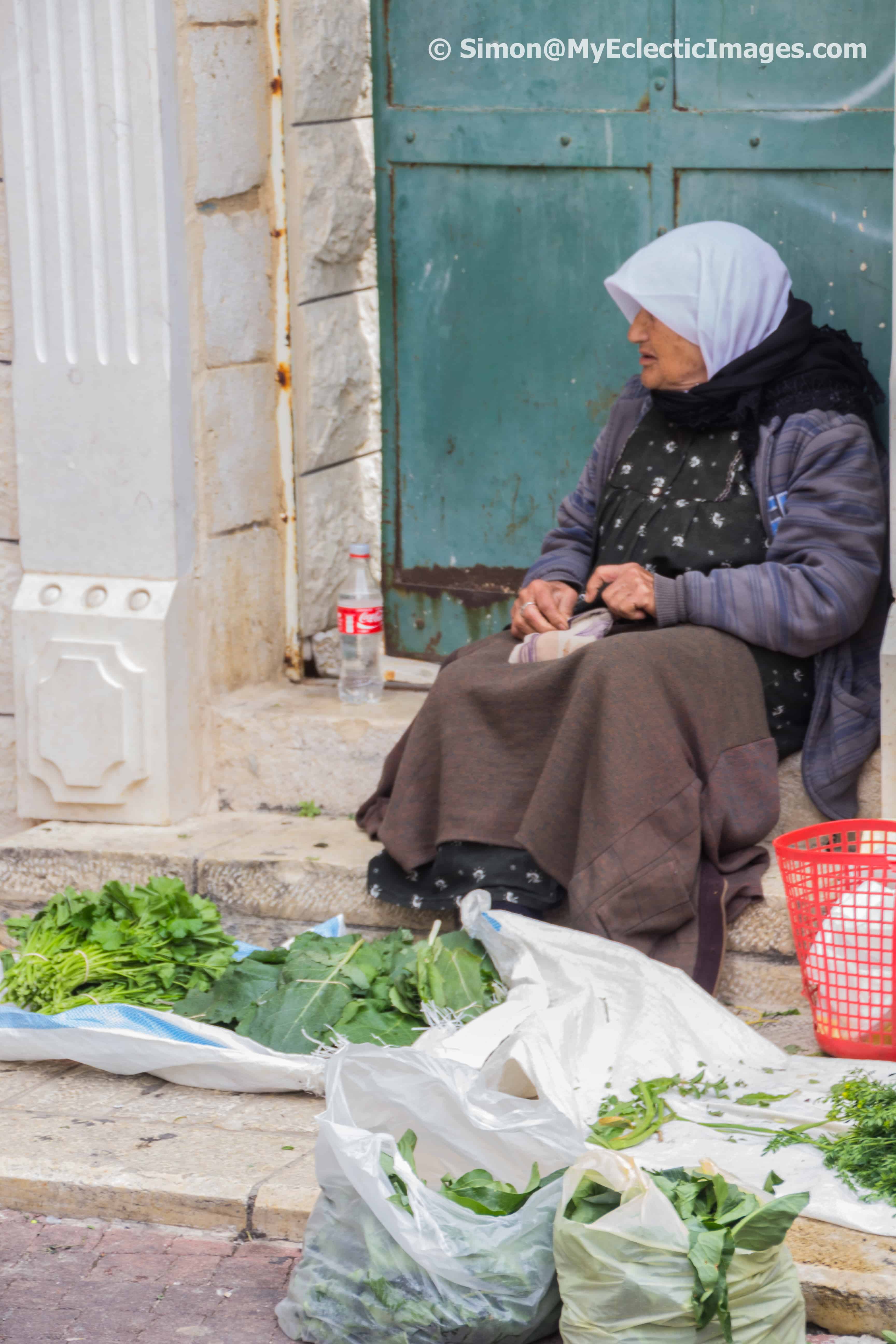Selling greens in the Nazareth Market Israel