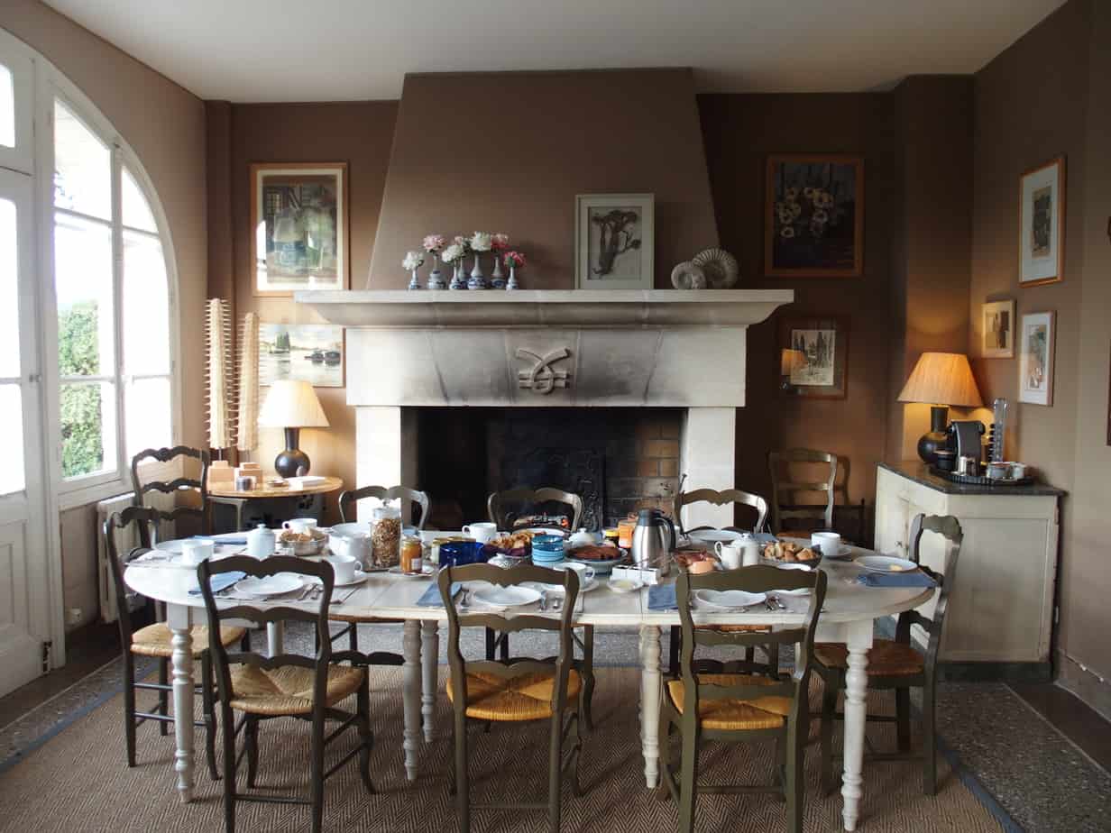 Communal breakfast table before the fireplace