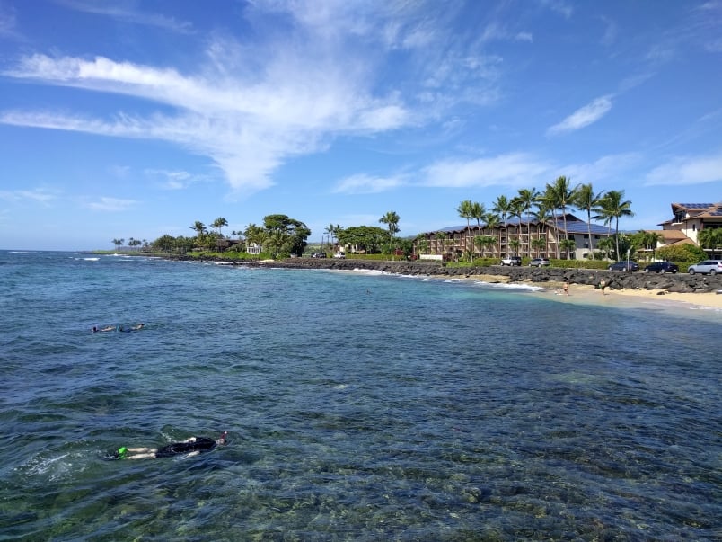 Snorkelers with Lawai Beach Resort in the Background