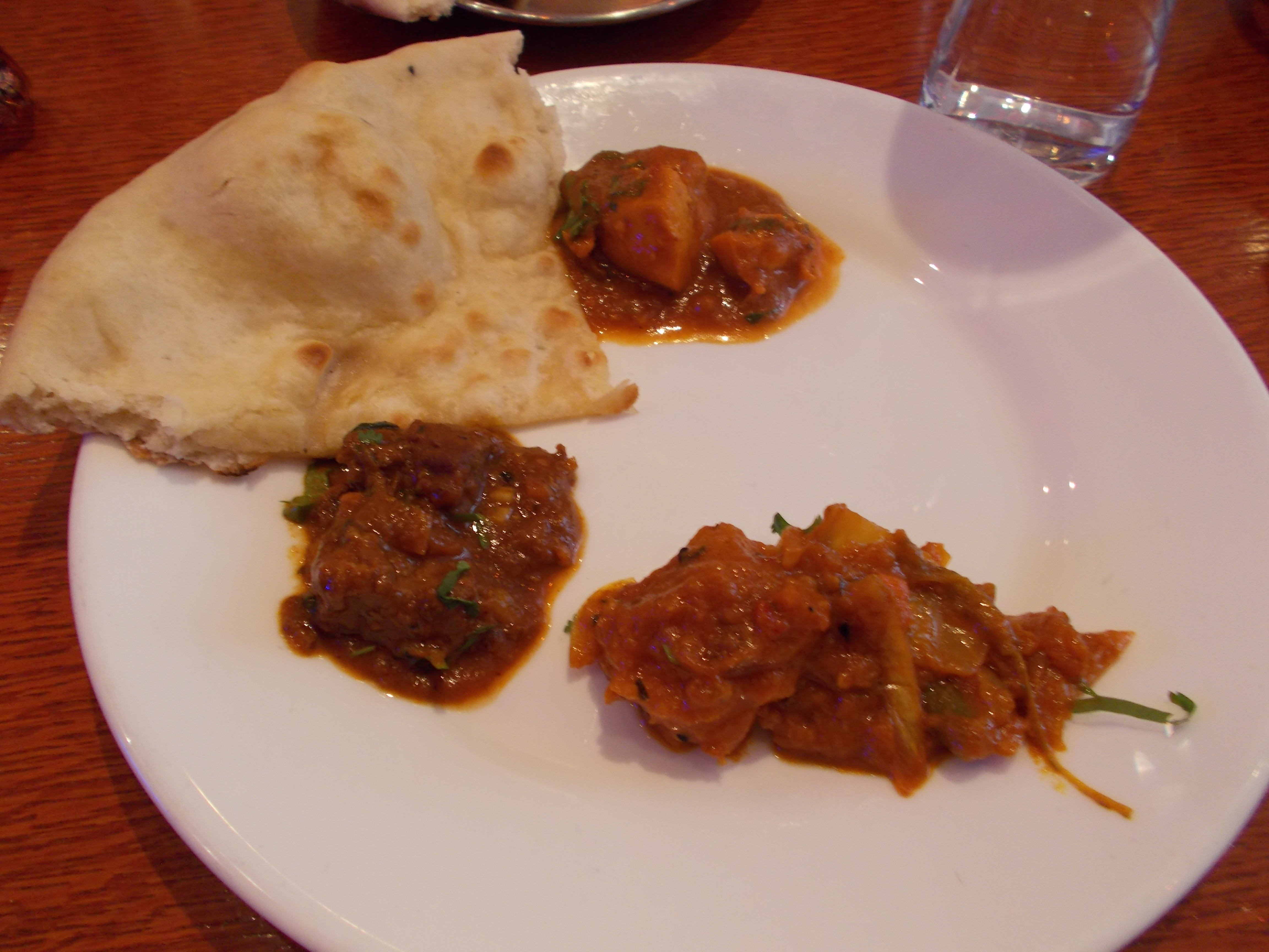 Naan with three different curries at Aladin London's Brick Lane